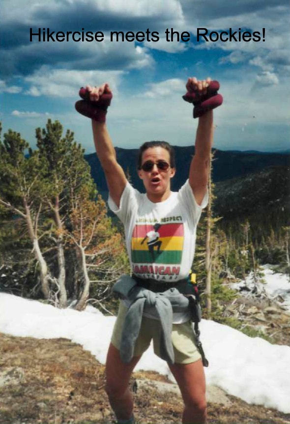 Hiker celebrating on a mountain summit