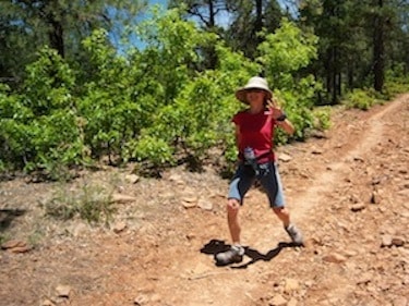 Hiker on a rocky trail in the forest